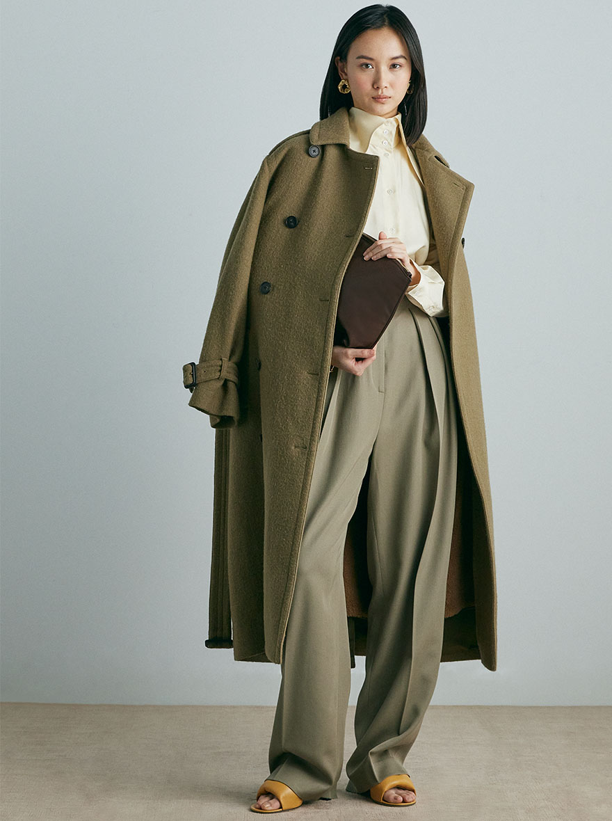 Woman wearing camel coloured trench coat