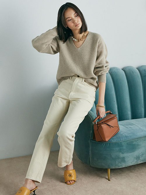 Woman in cream jumper and trousers